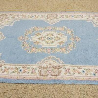 1199	WOOL THROW RUG W/FLORAL DESIGN, APPROXIMATELY 8 FT X 5 FT 5 IN
