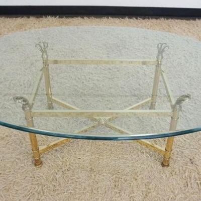 1182	OVAL BRASS COFFEE TABLE W/GLASS TOP, APPROXIMATELY 46 IN X 20 IN X 16 IN HIGH

