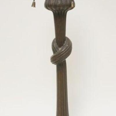 1053	ANTIQUE BRONZE LAMP BASE WITH REEDED SWIRLS TIED IN A KNOT IN CENTER, APPROXIMATELY 22 IN HIGH
