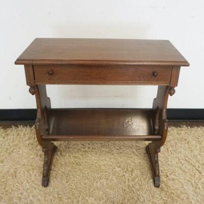 1163	SOLID WALNUT 1 DRAWER STAND WITH BOOK OR MAGAZINE SHELF IN CENTER AND DROP FINIALS ON TOP, APPROXIMATELY 12 IN X 24 IN X 25 IN HIGH
