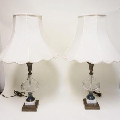 1011	PAIR OF CENTER CUT GLASS TABLE LAMPS ON MARBLE & CAST METAL BASES, APPROXIMATELY 33 IN HIGH
