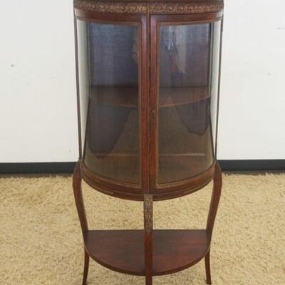 1152	VICTORIAN MAHOGANY CURVED GLASS CURIO CABINET WITH ORNATE METAL GALLERY TOP AND TRIM. SOME LOSS TO TRIM, APPROXIMATELY 25 IN X 15 IN...