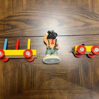 Antique children train cars and monkey figurine