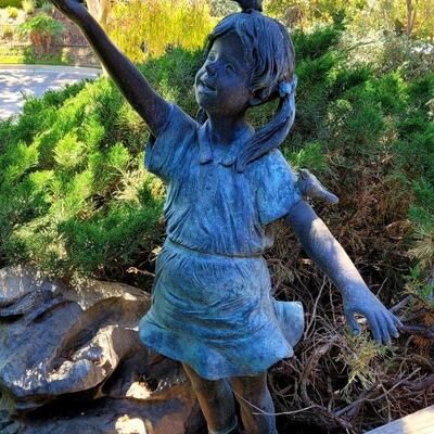 Large yard bronze girl with birds
