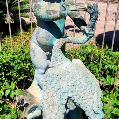 Large bronze...cherub with heron. 5 ft tall