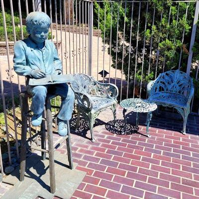 Large bronze boy yard art