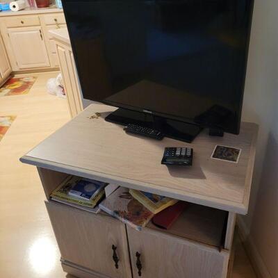 small cabinet/tv stand and a tv