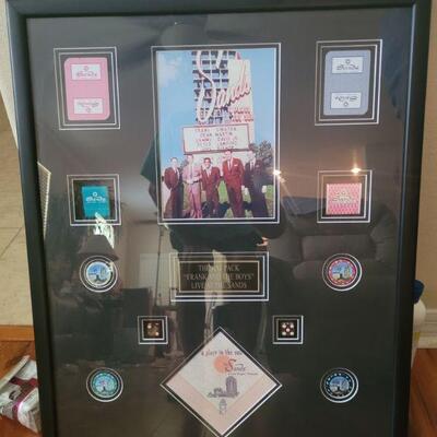 this piece has lots of memorabilia from Vegas and the Rat Pack. It even has real casino chips from the Sands Hotel. Very collectible piece