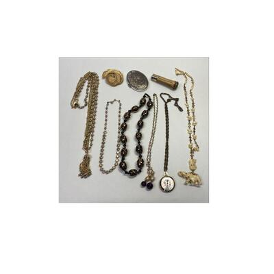 https://www.agesagoestatesales.com/product/po1044-vintage-jewelry-lot-of-6-necklaces-mirror-monet-pin-and-1940s-lipstick/172	PO1044...