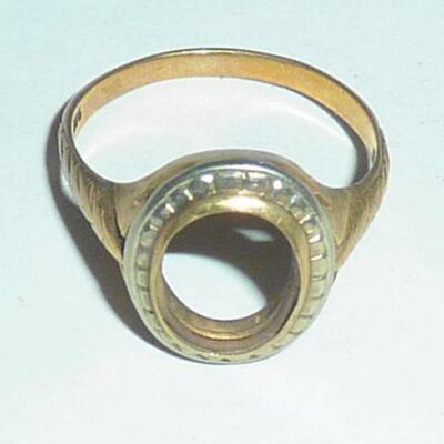 Gold ring with missing stone