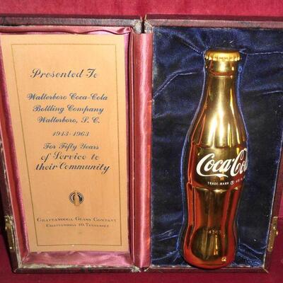 Coke award bottle in case with paperwork