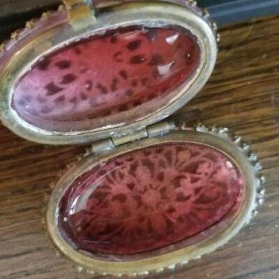 small gilded pill.box with cranberry liner