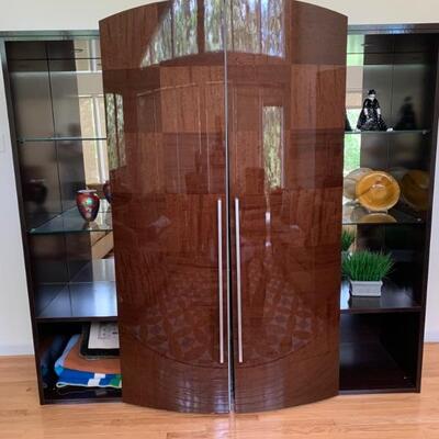 Unusual entertainment center. Difficult to photograph! Three sections come together with sliding doors. 82â€ w 31â€ d 79â€ h
A...