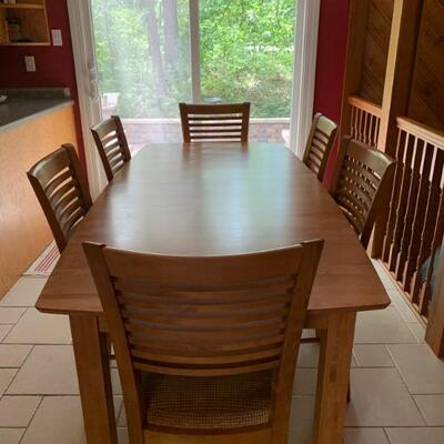 Beautiful Canadel (brand name) table and six chairs. Almost perfect table is 60â€ long with an 18â€ leaf 38â€ w 30â€ high. A lively...