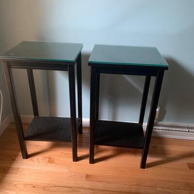 Two nightstands or end tables for a tight space. 
Glass topped. Black painted wood
16â€ w 14â€ d 29â€ h