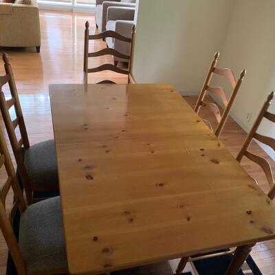 Casual dining table with four chairs and two arm chairs. Scratches on the top but not very noticeable. Table is 62â€ long 21â€ w...