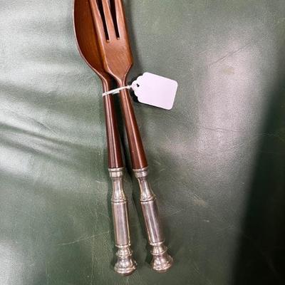 Antique wooden spoon and fork with silver handles