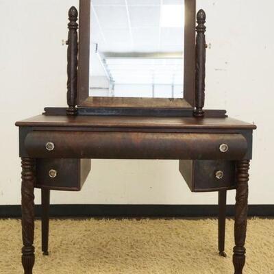 1069	EMPIRE STYLE MAHOGANY VANITY W/CARVED TURNED FRONT LEGS & OGEE MIRROR, FINISH WORN, APPROXIMATELY 40 IN X 21 IN X 58 IN HIGH
