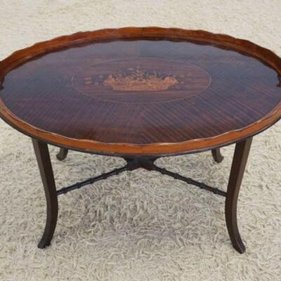 1079	ANTIQUE TRAY TABLE W/BOOK MATCHED VENEER TOP & FLORAL BASKET MEDALION INLAY AT CENTER, APPROXIMATELY 30 IN X 21 IN X 19 IN HIGH

