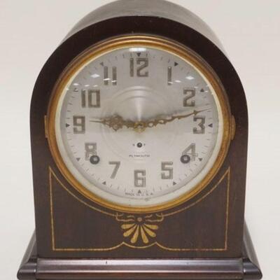 1038	MANTLE CLOCK BY THE PLYMOUTH CLOCK CO. CONNETICUT IN A MAHOGANY CASE, APPROXIMATELY 5 1/4 IN X 9 IN X 10 IN
