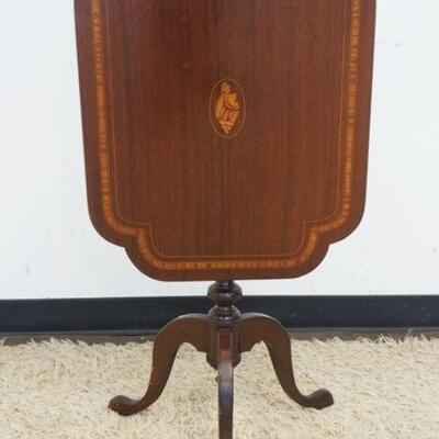 1052	FLIP TOP MAHOGANY STAND W/BANDED TOP & INLAID SHELL MEDALION, APPROXIMATELY 27 IN X 20 IN X 27 IN HIGH
