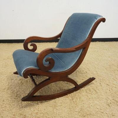 1076	ANTIQUE EMPIRE UPHOLSTERED ROCKER W/CURLED WALNUT ARMS
