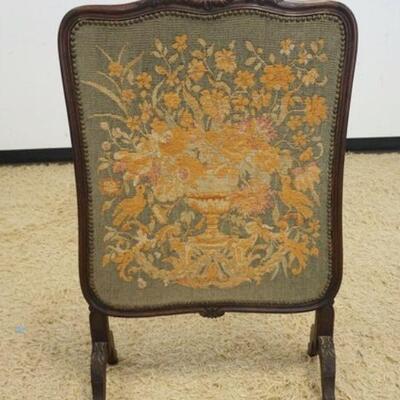 1075	ANTIQUE ENGLISH NEEDLEPOINT FIRESCREEN IN CARVED OAK FRAME, APPROXIMATELY 25 IN X 39 IN HIGH
