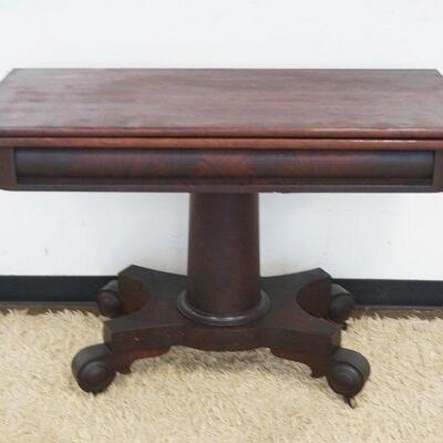 1053	ANTIQUE MAHOGANY EMPIRE FLIP TOP GAME TABLE, APPROXIMATELY 45 IN X 22 IN X 31 IN HIGH
