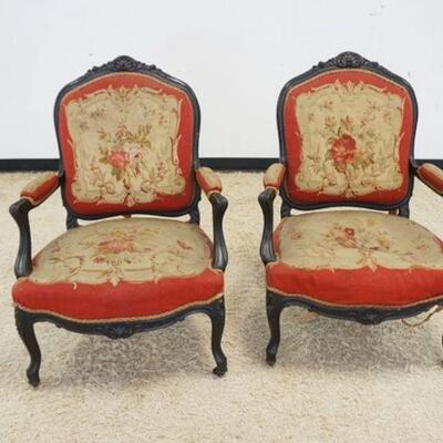 1054	PAIR OF ANTIQUE CONTINENTAL UPHOLSTERED ARMCHAIRS W/CARVED EBONIZED FRAMES, UPHOLSTERY IS WORN
