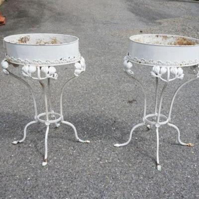 1057	PAIR OF ANTIQUE ORNATE OVAL METAL PLANT STANDS, APPROXIMATELY 23 IN X 20 IN X 31 IN HIGH
