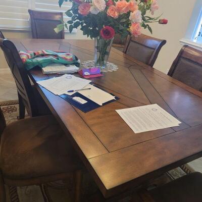 dining room table and eight chairs sold as a set