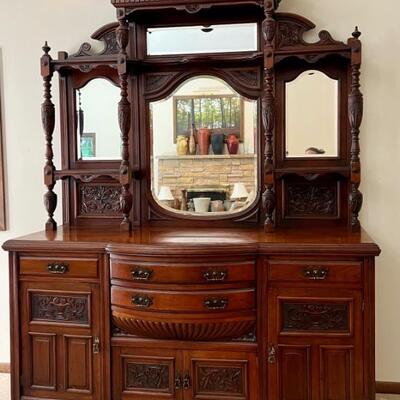 Gorgeous Antique English Edwardian Mahogany Sideboard with Carved Detailed Designs. Circa 1890-early 1900's. Truly a masterpiece! The...