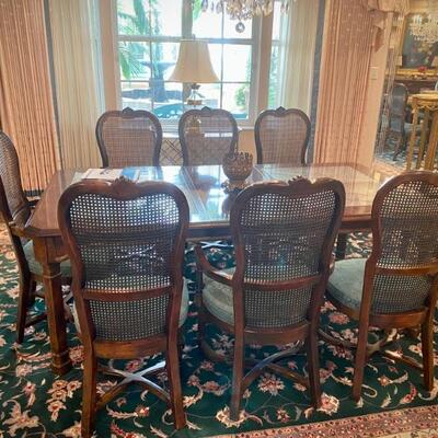Dining set with 8 caned chairs, 2 leaves, and table protector
