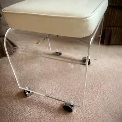 Lucite wheeled stool with rotating seat