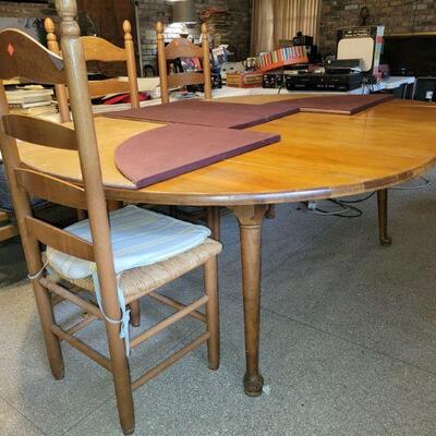 Solid wood dining table with ladderback chairs