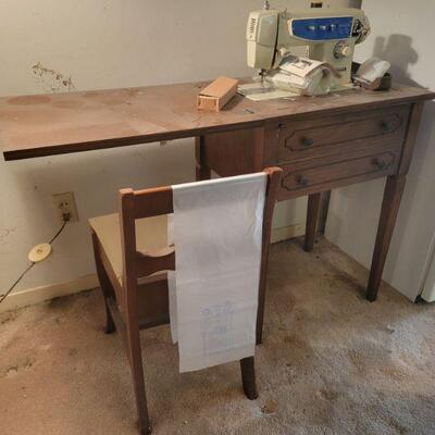 Sewing machine cabinet with chair