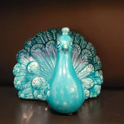 Cute turquoise ceramic peacock