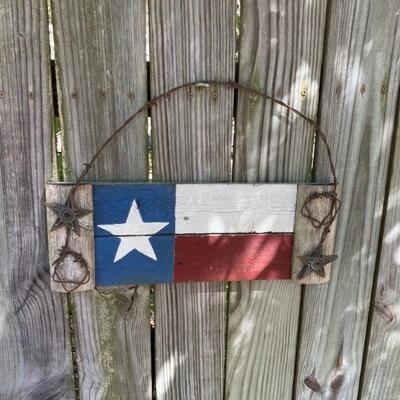 Texas flag painted on wood with cast iron architectural stars 