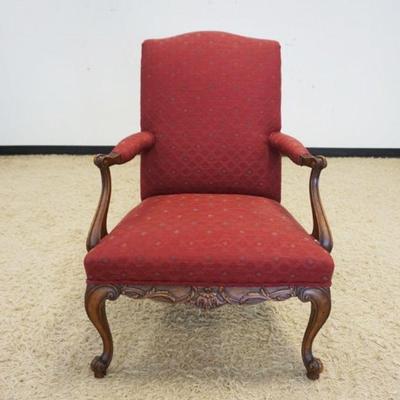 1127	UPHOLSTERED ARM CHAIR WITH CARVED WALNUT SKIRT AND FRENCH PROVINCIAL LEGS
