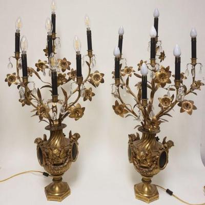 1062	PAIR OF GILT BRONZE CANDELABRA LAMPS HAVING URN BASES FLANKED BY WINGED CHERUBS & MEDALION, TOP HAVING FLOWERS & PRISMS,...
