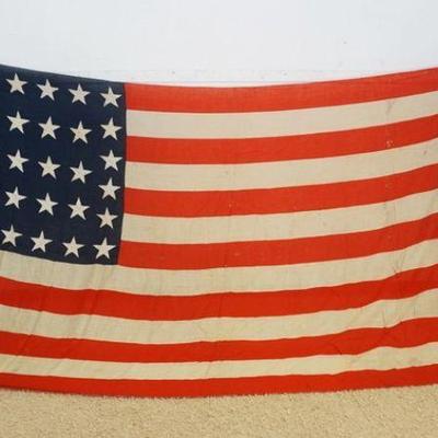 1076	ANTIQUE 38 STAR FLAG UNITED STATES OF AMERICA 1837, HAND SEWN, FLAG HAS WEAR, APPROXIMATELY 97 IN X 194 IN
