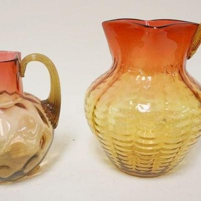 1293	2 VICTORIAN BLOWN GLASS AMBERINA PITCHERS W/APPLIED HANDLES, LARGEST IS APPROXIMATELY 8 IN HIGH
