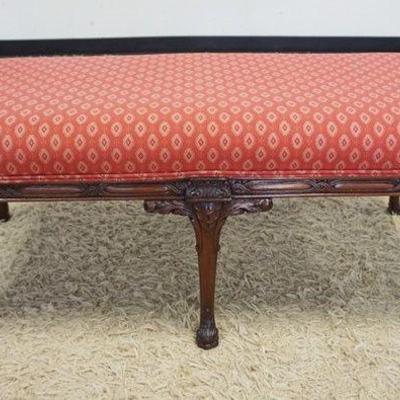 1122	UPHOLSTERED WALNUT WINDOW BENCH WITH CARVED SKIRT AND LEGS, APPROXIMATELY 55 IN X 35 IN X 33 IN HIGH
