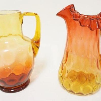 1291	2 VICTORIAN BLOWN GLASS AMBERINA PITCHERS W/APPLIED HANDLES, LARGEST IS APPROXIMATELY 8 IN HIGH

