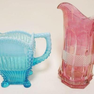 1238	LOT U.S. GLASS VIRGINIA PINK STAINED PITCHER & NORTHWOOD BLUE OPALESCENT ALASKA PTCHER, TALLEST IS APPROXIMATELY 11 IN HIGH
