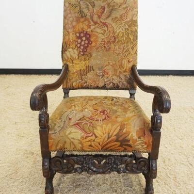 1022	CONTINENTAL HEAVILY CARVED UPHOLSTERED ARMCHAIR, UPHOLSTERY WORN
