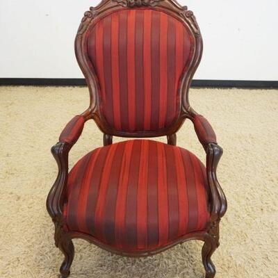 1024	WALNUT VICTORIAN  UPHOLSTERED ARMCHAIR W/FRUIT CARVED CREST
