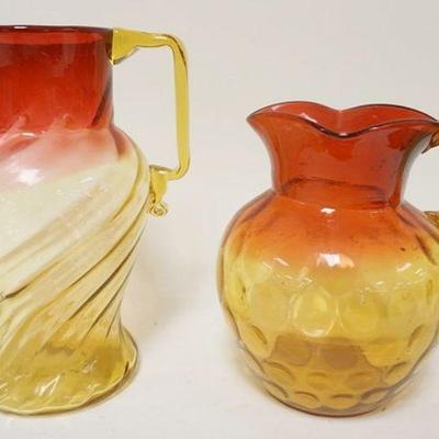 1292	2 VICTORIAN BLOWN GLASS AMBERINA PITCHERS W/APPLIED HANDLES, LARGEST IS APPROXIMATELY 9 IN HIGH
