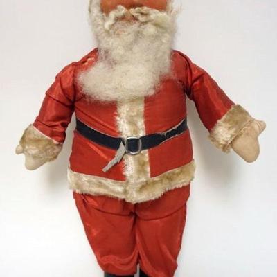 1207	LARGE ANTIQUE STRAW FILLED SANTA WITH HAND PAINTED EYES. SOME WEAR TO SUIT, APPROXIMATELY 26 IN HIGH
