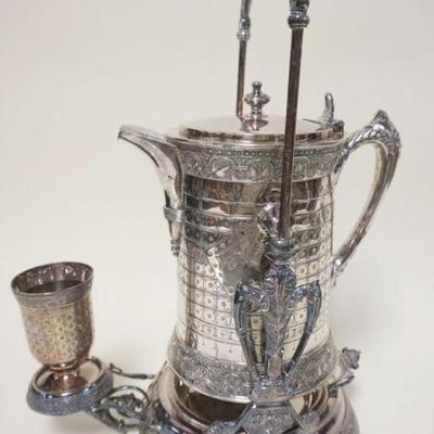 1211	VICTORIAN SILVER PLATE ICE WATER PITCHER IN STAND WITH CUP, PITCHER HAS A DENT, APPROXIMATELY 21 IN HIGH

